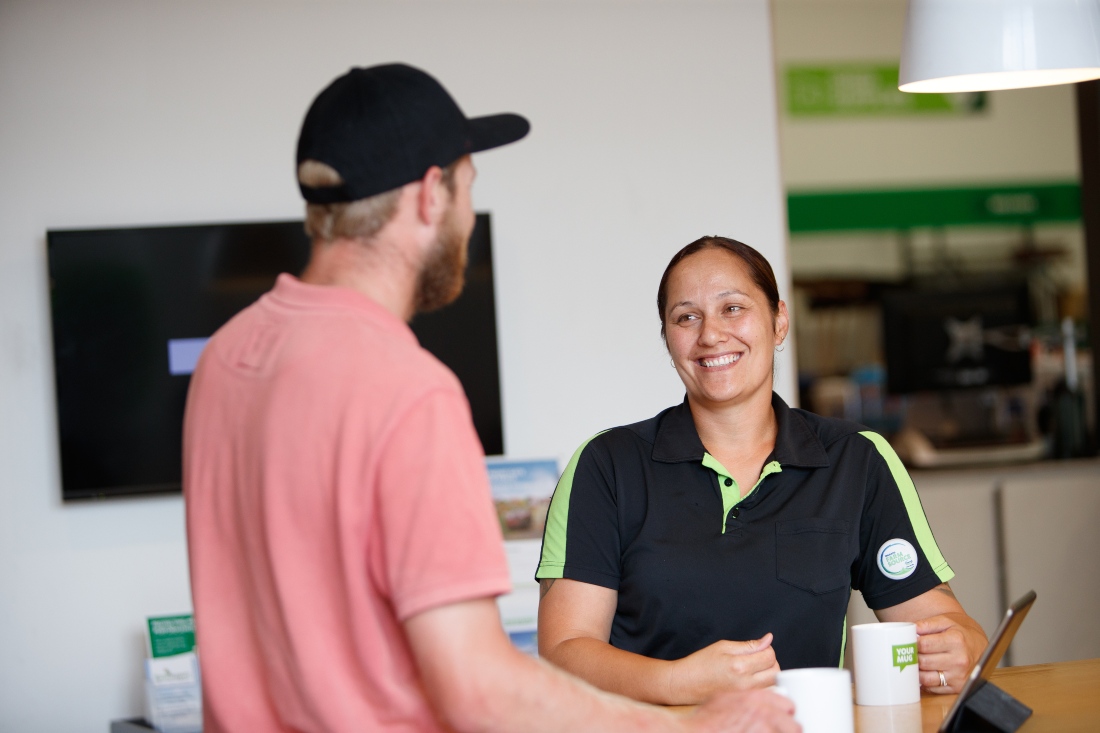 Customer and Farm Source staff member chatting