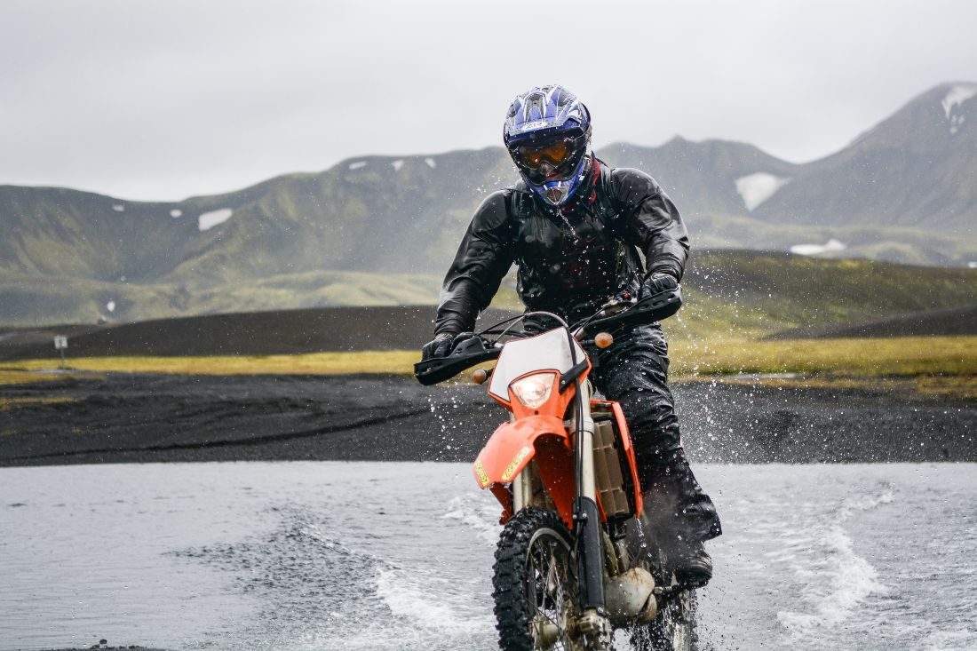 Person riding motorcycle outside