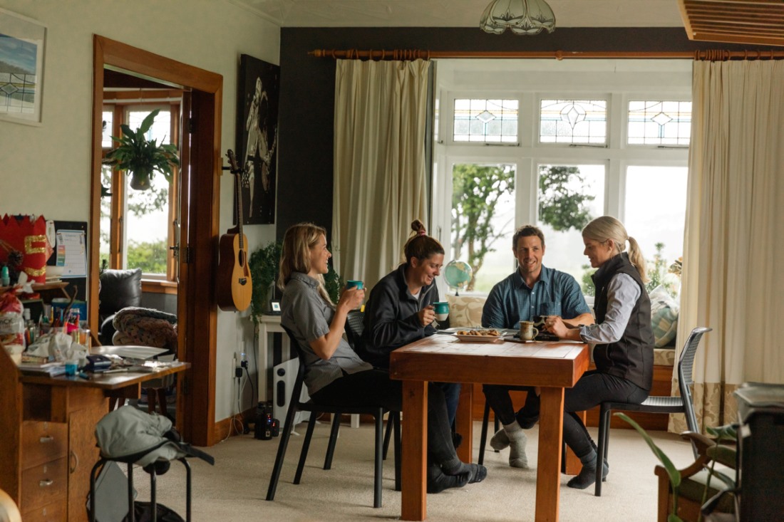 Farmers and Farm Source team gathered around a table
