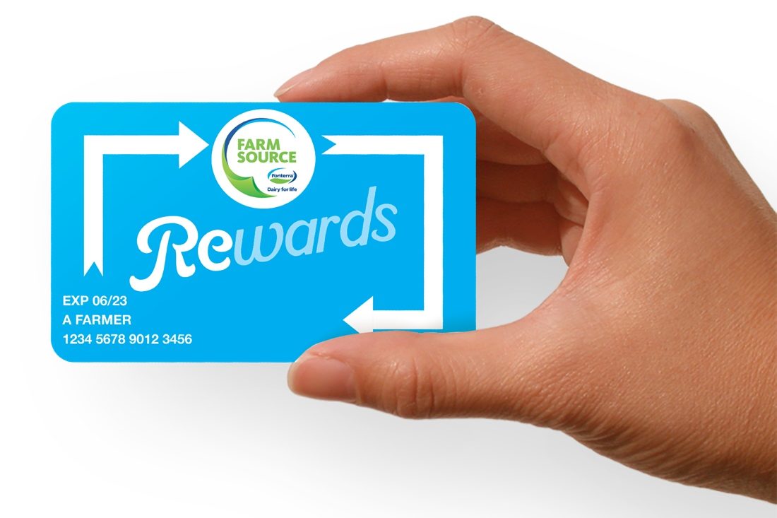 Hand holding Farm Source Rewards card