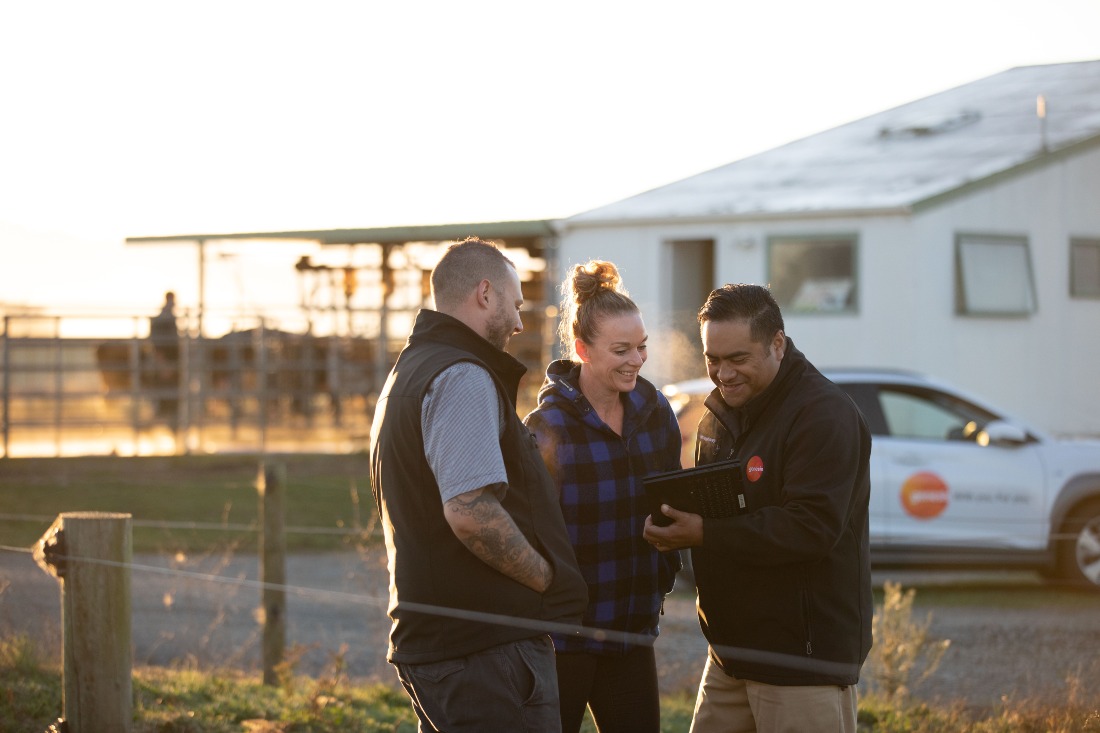 Genesis rep talking to farmers