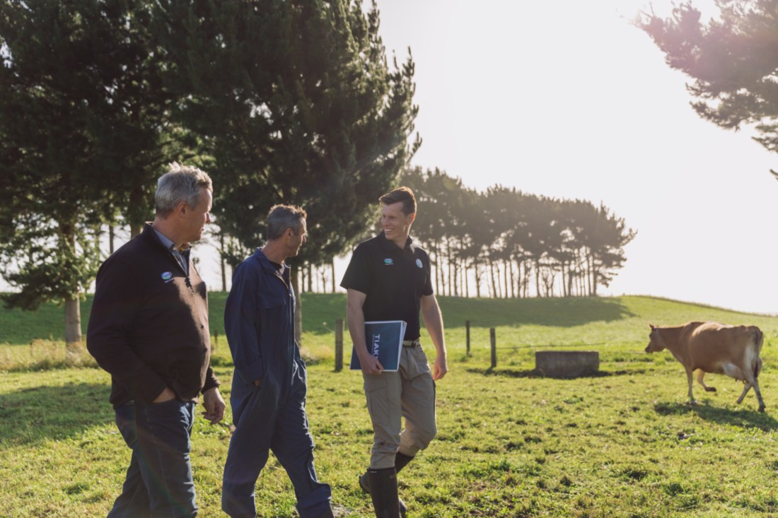 Farm Source staff walking with farmers